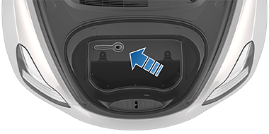 Arrow pointing to the tow eye in the front trunk.