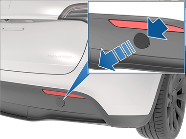 Arrow pointing to the vehicle's tow eye cover.